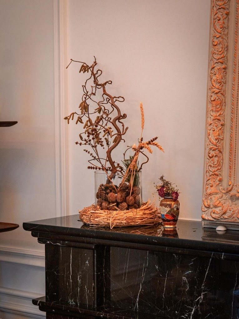 Elegant dried arrangement on a marble mantel